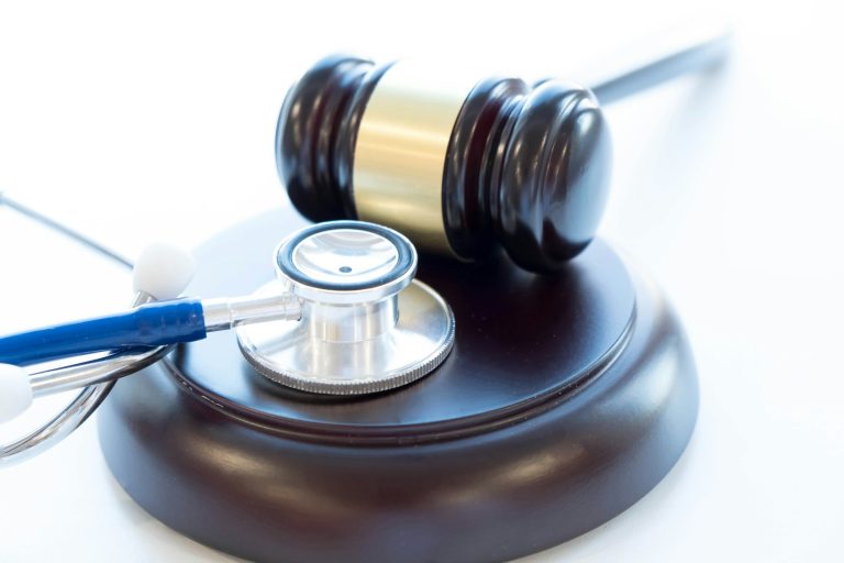 Gavel and stethoscope. medical jurisprudence. legal definition of medical malpractice.