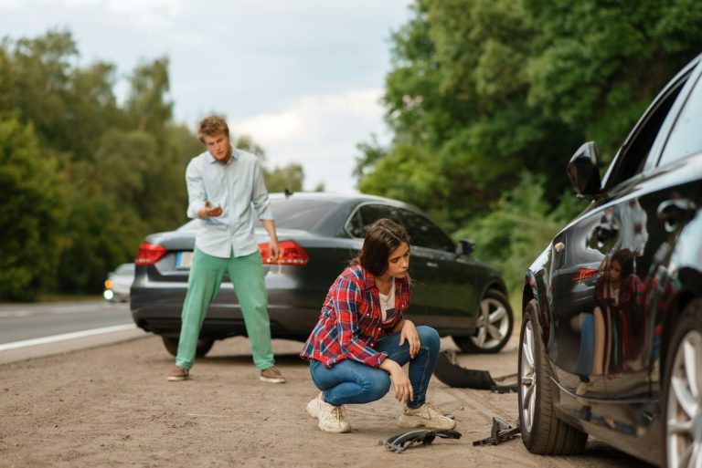 Male and female drivers are shouting, car accident